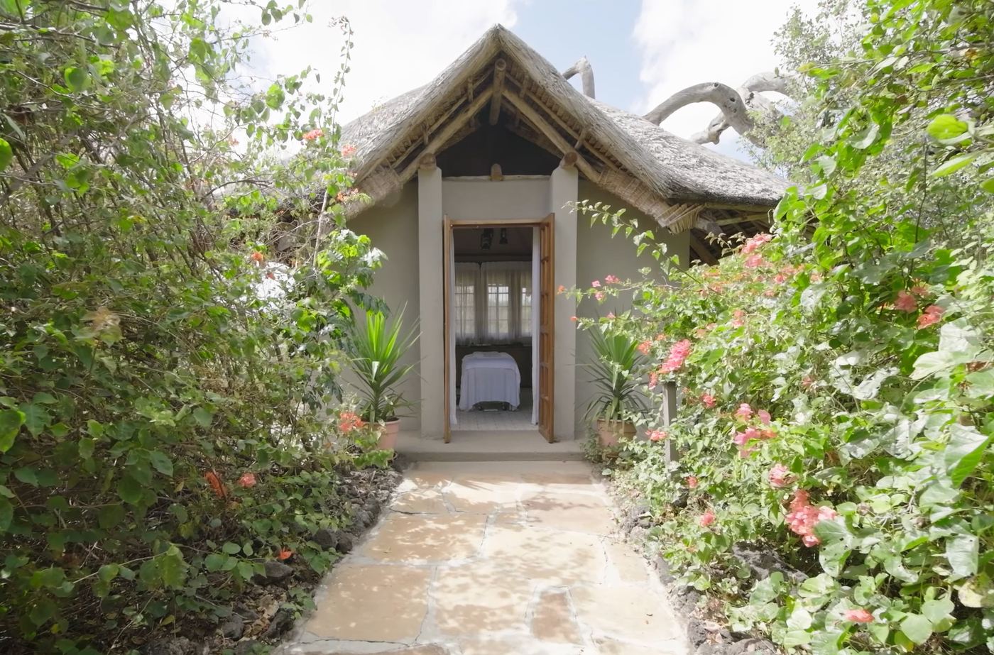 A garden path to a thatched treatment room at the Finch Hattons spa.