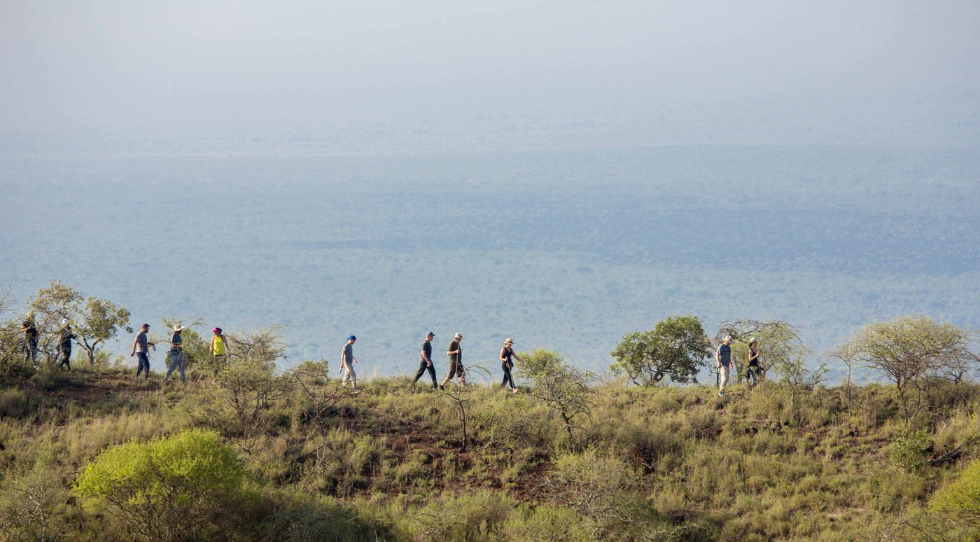 Guests walking a ridge on the volcano hike from Finch Hattons.