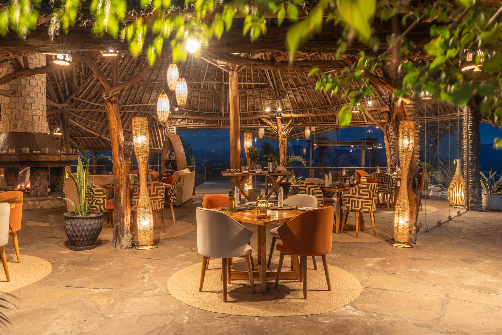 The dining area under thatch, set for dinner