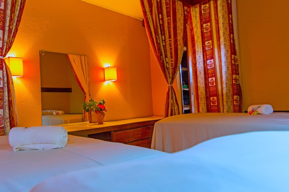 Warm curtains and lamplight set the tone in a guest room at Ngulia Safari Lodge